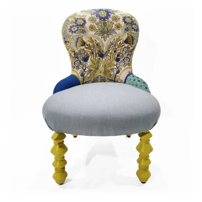 Contessa Eleonora elegant armchair with teal fabric and vibrant yellow hand-turned legs, tiny stylish design for bedrooms.